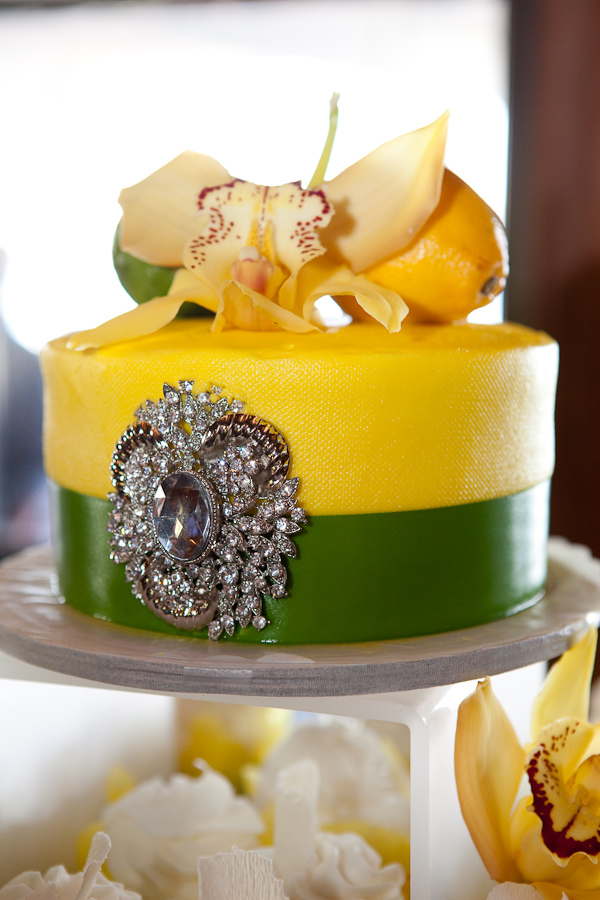 yellow and chartruese cake with beautiful jewel detail and orchid, lemon and lime topper - photo by Seattle based wedding photographers La Vie Photography